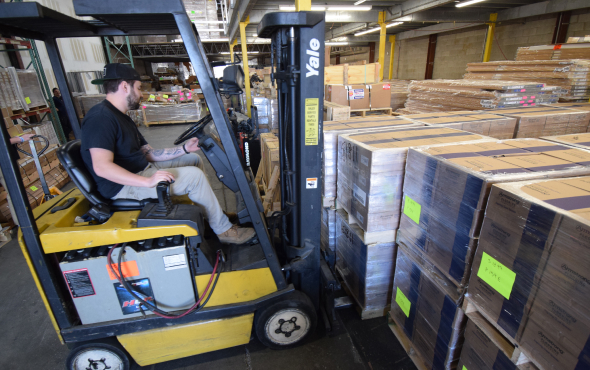 Milburn Flooring warehouse stocked with Armstrong VCT flooring boxes for quick delivery.
