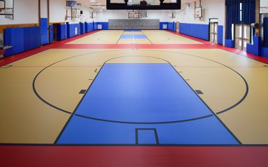 Pulastic flooring Idle Hour project featuring bright, seamless sports flooring in the school gym.