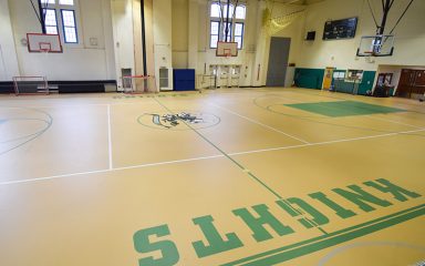 New Rochelle Pulastic Flooring installation in a bright, modern school gym.