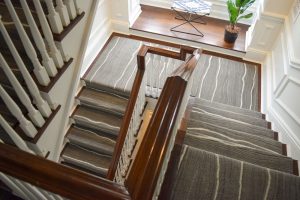 Healthcare facility with carpeted stairs, showcasing flooring solutions that improve traction and safety.
