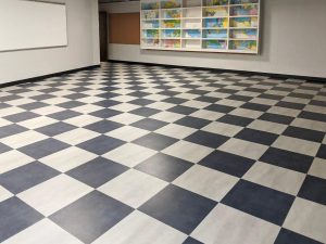 School flooring installation featuring long-lasting vinyl composition tile in an educational facility