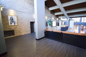 Durable luxury vinyl tile flooring installed in a high-traffic school corridor