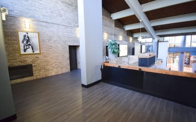 Durable luxury vinyl tile flooring installed in a high-traffic school corridor