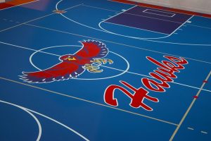 Seamless Pulastic gym floor with custom game lines and school colors