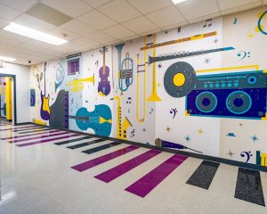 LVT flooring in a busy school hallway to absorb sound and reduce footstep noise