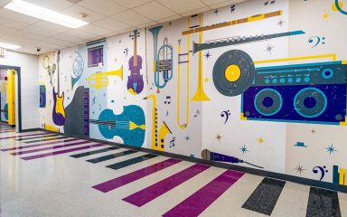 LVT flooring in a busy school hallway to absorb sound and reduce footstep noise