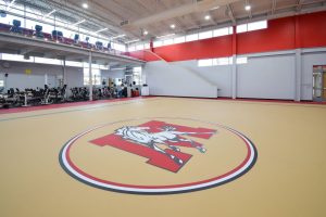 Slip-resistant gym pulastic flooring designed to protect students during sports and high-traffic activity